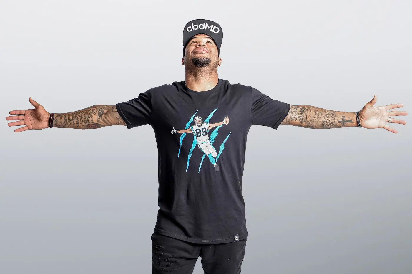 Steve Smith Sr. wearing a custom graphic T-shirt from a Charlotte apparel collaboration